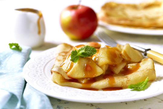 Pancakes with caramelized apple and caramel sauce.