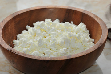 cottage cheese in a wooden bowl