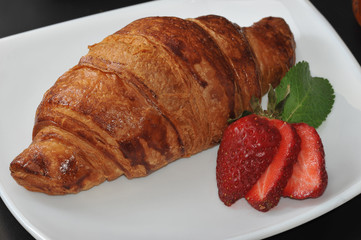 coffee and a croissant - a croissant with strawberry