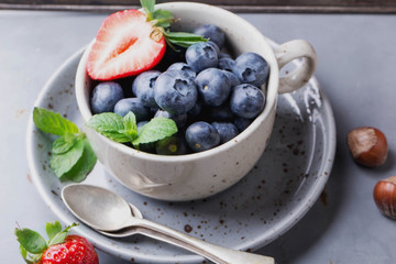 Strawberries and Blueberries on metal background