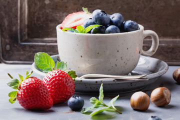 Strawberries and Blueberries on metal background