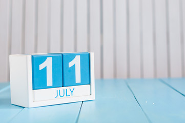 July 11th. Image of july 11 wooden color calendar on white background. Summer day. Empty space for text. World Chocolate Day