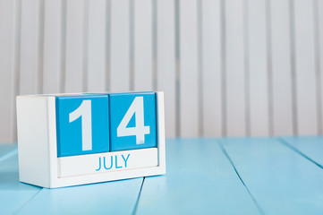 July 14th. Image of july 14 wooden color calendar on white background. Summer day. Empty space for text. Storming Of the Bastille Day