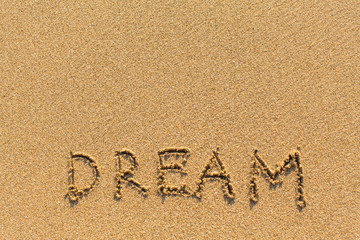 Dream - drawn of the hand on the beach sand.