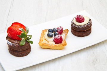 trio of cakes with fruit