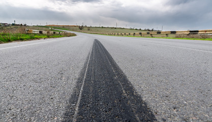 trail brakes on asphalt closeup