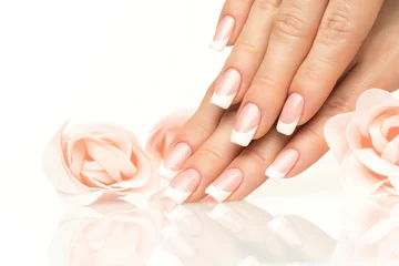 Wall murals Manicure Woman hands with french manicure  close-up