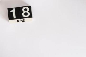 June 18th. Image of june 18 wooden color calendar on white background. Summer day. Empty space for text