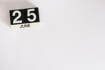 June 25th. Image of june 25 wooden color calendar on white background. Summer day. Empty space for text