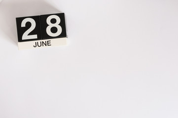 June 28th. Image of june 28 wooden color calendar on white background. Summer day. Empty space for text