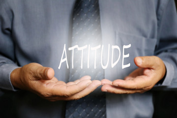 Attitude word on hand, businessman