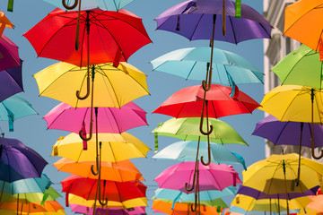 Fototapeta na wymiar Colorful umbrellas un blue sky,