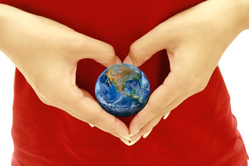 the earth on heart hand ,including elements furnished by NASA