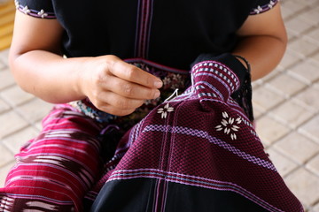 women hand sewing, Thailand