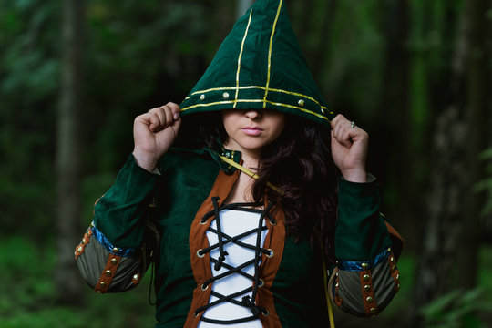  Staging photo of beautiful woman in fantasy suit with hood