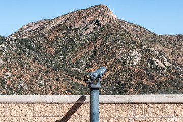 Viewing scope at Mission Trails Regional Park in San Diego, California with mountain peak in...