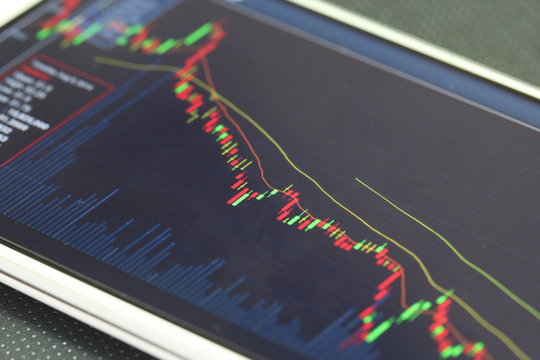 smartphone and stock chart, investment