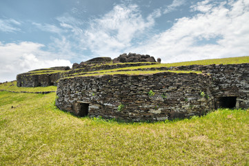 Ceremonial village Orongo on hillsides of the volcano Rano Kao on  Easter island  - obrazy, fototapety, plakaty