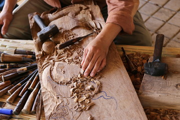 craftsman carving wood