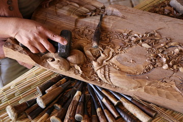 craftsman carving wood