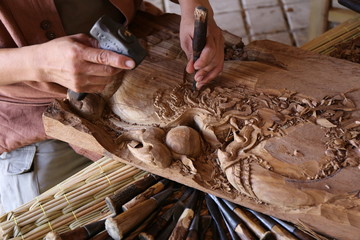 craftsman carving wood