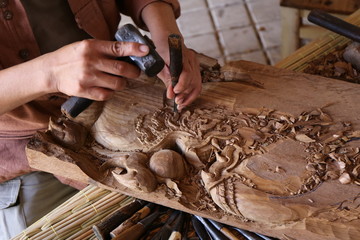 craftsman carving wood