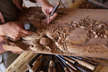 craftsman carving wood - 107704584