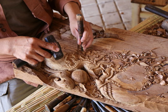 craftsman carving wood