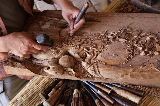 craftsman carving wood