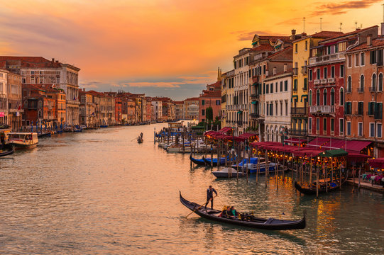 Sunset view of Grand Canal with gondolas in Venice. Italy