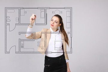 Female architect working with a virtual apartment plan