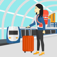 Woman with suitcase on wheels and briefcase.