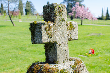 Grassy Graveyard Cross / Gravestone at a cemetery in East Vancouver, BC, Canada