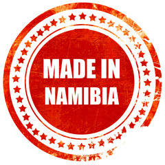 Made in namibia, grunge red rubber stamp on a solid white backgr