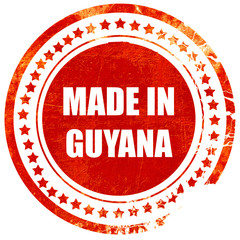 Made in guyana, grunge red rubber stamp on a solid white backgro