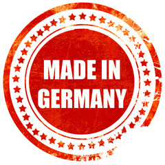 Made in germany, grunge red rubber stamp on a solid white backgr