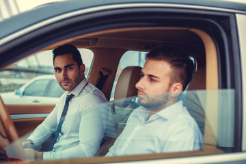 Two guys in a car.