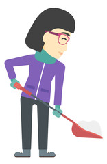 Woman shoveling and removing snow.