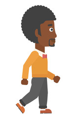 Smiling businessman walking