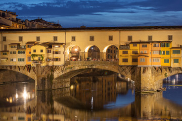 View of Gold (Ponte Vecchio) Bridge at night in Florence, Tuscan