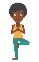 Woman practicing yoga.