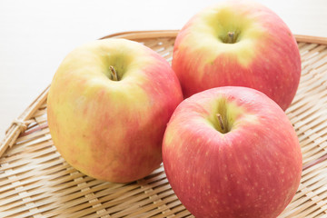 Red apple in basket