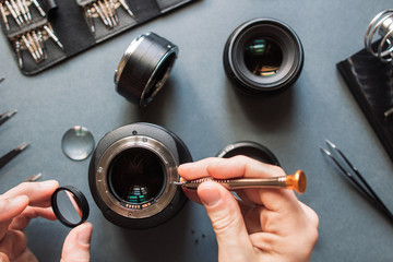 Photo camera lens repair set. Technician engineer check optics alignment and maintenance support of...