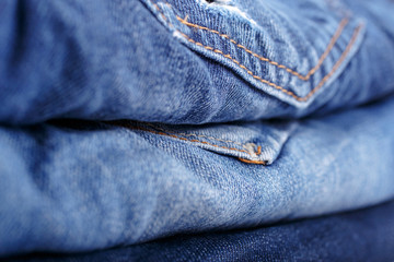 Fototapeta premium Stack blue jeans closeup