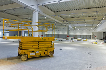 Scissor lift platform on a construction site.