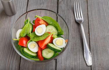 Fresh salad with spinach leaves