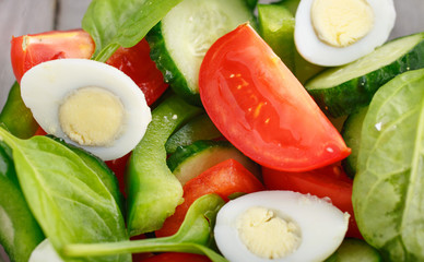 Closeup fresh salad with spinach leaves