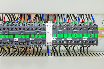 Electrical panel has automatic fuse switches, close up.