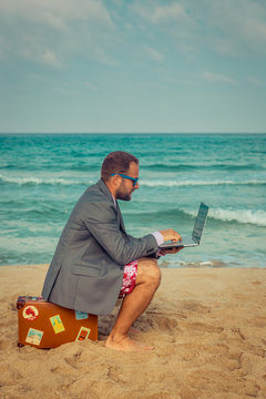 Funny businessman on the beach