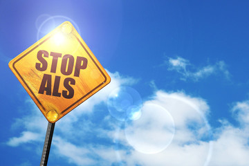 Yellow road sign with a blue sky and white clouds: stop when